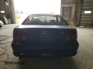 1996 Ford Mustang with VIN 1FALP4048TF150951, listed as a Copart auction lot 59298985 with 83,053 mi miles and Salvage title. Bid and sale history available at DreamBid. Image 6.
