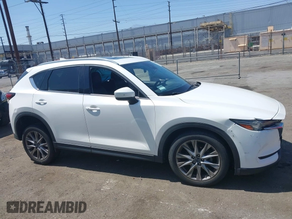 2020 Mazda CX-5 Grand Touring with VIN JM3KFADM9L0821930, listed as a IAAI auction lot 42549986 with 29,929 mi miles and . Bid and sale history available at DreamBid. Image 13.