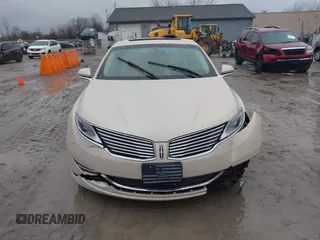 2015 Lincoln MKZ z VIN 3LN6L2J96FR618325, wystawiony jako IAAI lot #41046851 z przebiegiem Nie podano mil oraz . Historia ofert i sprzedaży dostępna na DreamBid. Obrazek 12.