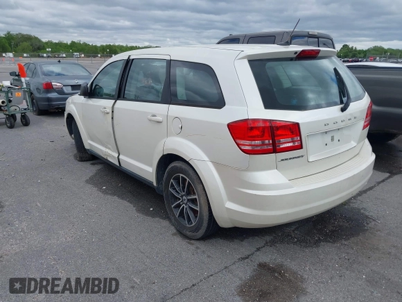 2014 Dodge Journey SE with VIN 3C4PDCAB1ET192530, listed as a IAAI auction lot 41987728 with 186,486 mi miles and . Bid and sale history available at carsss.com. Image 3.