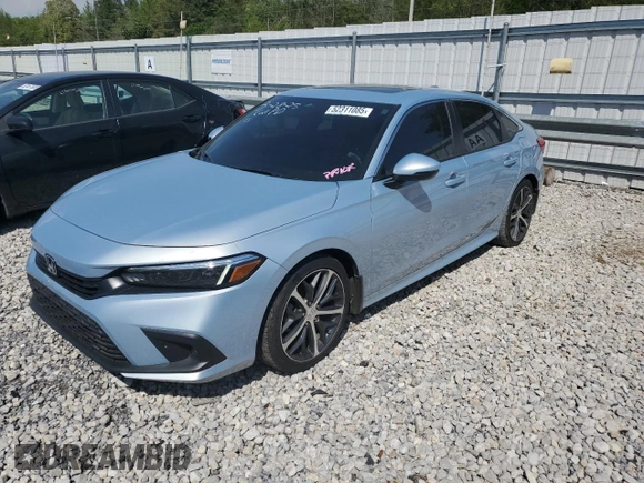 2023 Honda Civic Touring z VIN 2HGFE1F94PH310134, wystawiony jako Copart lot #52311085 z przebiegiem 32 682 mil mil oraz Szkoda całkowita • Salvage title. Historia ofert i sprzedaży dostępna na DreamBid. Obrazek 1.
