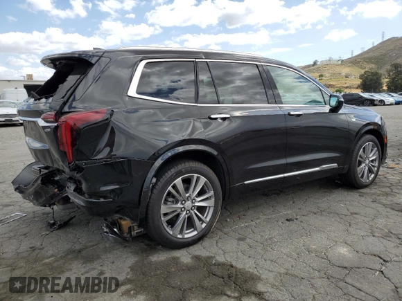 2023 Cadillac XT6 FWD Premium Luxury with VIN 1GYKPCRS5PZ220616, listed as a Copart auction lot 56913725 with 25,860 mi miles and Salvage title. Bid and sale history available at DreamBid. Image 3.