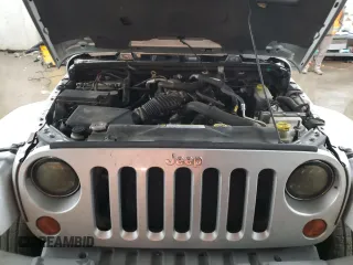 2009 Jeep Wrangler Sahara z VIN 1J4FA54189L789642, wystawiony jako Copart lot #89078145 z przebiegiem 128 902 mil mil oraz Szkoda całkowita • Salvage title. Historia ofert i sprzedaży dostępna na DreamBid. Obrazek 12.
