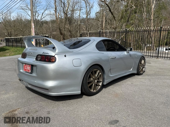 1993 Toyota Supra с VIN JZA800010229, выставлен на аукционе Copart как лот 50000065 с пробегом 130 612 миль миль и Чистый • Clean title. История ставок и продаж доступна на DreamBid. Изображение 4.