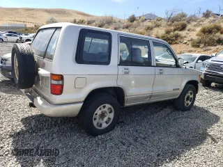 1994 Isuzu Trooper z VIN JACDH58V7R7929502, wystawiony jako Copart lot #70280554 z przebiegiem 243 827 mil mil oraz Tytuł czysty. Historia ofert i sprzedaży dostępna na DreamBid. Obrazek 3.