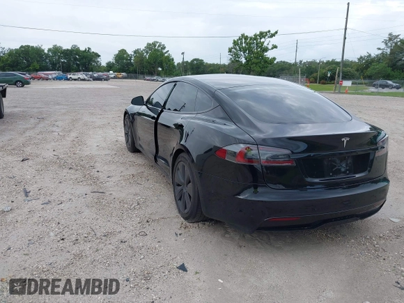 2022 Tesla Model S with VIN 5YJSA1E51NF472152, listed as a IAAI auction lot 42625943 with 60,290 mi miles and . Bid and sale history available at DreamBid. Image 3.