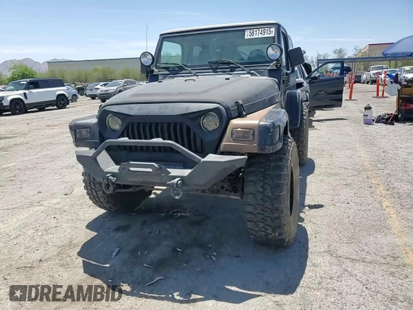 1999 Jeep Wrangler Sahara with VIN 1J4FY49S8XP472733, listed as a Copart auction lot 58174915 with 170,838 mi miles and Salvage title. Bid and sale history available at DreamBid. Image 15.