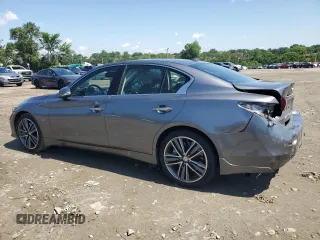 2015 Infiniti Q50 Premium with VIN JN1BV7AR6FM415389, listed as a Copart auction lot 61653845 with 124,141 mi miles and Salvage title. Bid and sale history available at DreamBid. Image 2.
