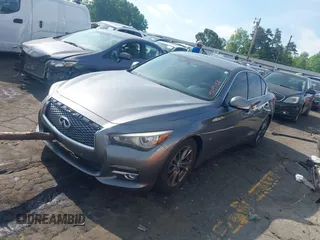 2014 Infiniti Q50 Premium with VIN JN1BV7AP2EM688259, listed as a IAAI auction lot 42149158 with 252,078 mi miles and . Bid and sale history available at DreamBid. Image 2.