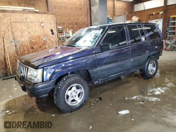1997 Jeep Grand Cherokee Laredo with VIN 1J4GZ58Y7VC678708, listed as a Copart auction lot 87803725 with 312,585 mi miles and Salvage Title. Bid and sale history available at carsss.com. Image 1.
