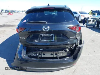 2021 Mazda CX-5 Touring with VIN JM3KFACM2M0339349, listed as a IAAI auction lot 41651005 with 53,792 mi miles. Bid and sale history available at carsss.com. Image 16.