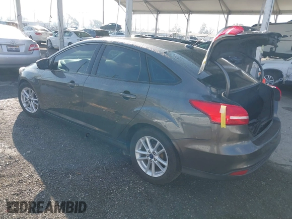 2018 Ford Focus SE with VIN 1FADP3F27JL285891, listed as a IAAI auction lot 41750264 with 103,815 mi miles. Bid and sale history available at carsss.com. Image 3.