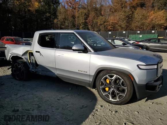 2022 Rivian R1T Launch Edition z VIN 7FCTGAAL6NN002704, wystawiony jako Copart lot #77913144 z przebiegiem 40 665 mil mil oraz Szkoda całkowita • Salvage title. Historia ofert i sprzedaży dostępna na DreamBid. Obrazek 4.
