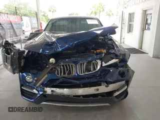 2015 BMW X4 xDrive28i with VIN 5UXXW3C51F0M87268, listed as a IAAI auction lot 42366363 with 143,285 mi miles and . Bid and sale history available at DreamBid. Image 13.