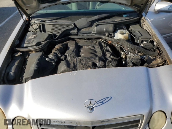 2002 Mercedes-Benz E-Class with VIN WDBJF65J32B496411, listed as a Copart auction lot 75690884 with 128,855 mi miles and Salvage Title. Bid and sale history available at carsss.com. Image 11.