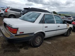 1991 Toyota Camry z VIN 4T1SV24E5MU355011, wystawiony jako Copart lot #51021185 z przebiegiem 135 881 mil mil oraz Czysty tytuł • Clean title. Historia ofert i sprzedaży dostępna na DreamBid. Obrazek 3.