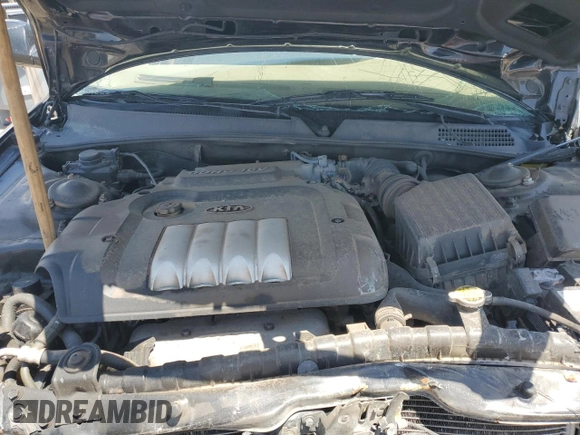 2006 Kia Optima LX z VIN KNAGD126865452524, wystawiony jako Copart lot #59813015 z przebiegiem 130 090 mil mil oraz Szkoda całkowita • Salvage title. Historia ofert i sprzedaży dostępna na DreamBid. Obrazek 11.
