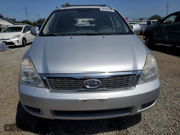 2012 Kia Sedona LX with VIN KNDMG4C72C6445242, listed as a Copart auction lot 54164455 with 143,124 mi miles and Salvage Title. Bid and sale history available at carsss.com. Image 5.