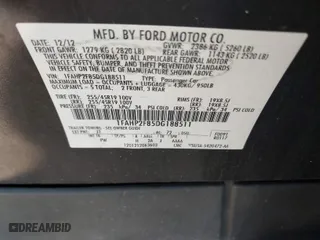 2013 Ford Taurus Limited with VIN 1FAHP2F85DG188511, listed as a IAAI auction lot 42077614 with 165,059 mi miles. Bid and sale history available at carsss.com. Image 9.