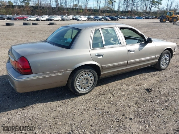 2003 Mercury Grand Marquis GS Convenience with VIN 2MEFM74W43X681774, listed as a IAAI auction lot 42057422 with 218,422 mi miles. Bid and sale history available at carsss.com. Image 4.