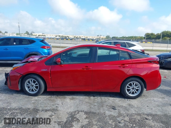 2021 Toyota Prius L Eco with VIN JTDKAMFU4M3145215, listed as a IAAI auction lot 41926274 with 74,220 mi miles. Bid and sale history available at carsss.com. Image 14.