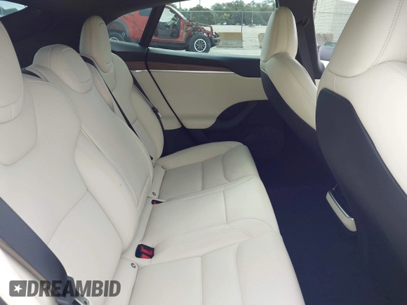 2022 Tesla Model S with VIN 5YJSA1E51NF472152, listed as a IAAI auction lot 42625943 with 60,290 mi miles and . Bid and sale history available at DreamBid. Image 8.