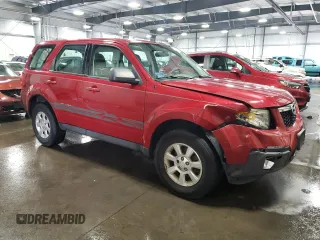 2011 Mazda Tribute Touring with VIN 4F2CY0C71BKM06780, listed as a Copart auction lot 77748114 with 144,163 mi miles and Salvage Title. Bid and sale history available at carsss.com. Image 4.