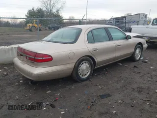 1997 Lincoln Continental with VIN 1LNLM97V3VY666104, listed as a IAAI auction lot 41650904 with 181,536 mi miles. Bid and sale history available at carsss.com. Image 4.