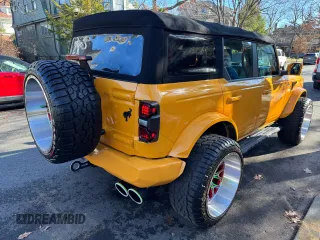 2022 Ford Bronco with VIN 1FMDE5DH4NLA79044, listed as a Copart auction lot 87172704 with 21,281 mi miles and Clean Title. Bid and sale history available at DreamBid. Image 4.
