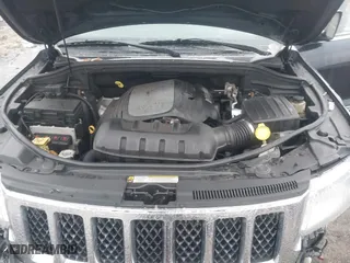 2012 Jeep Grand Cherokee Overland with VIN 1C4RJFCT9CC182216, listed as a IAAI auction lot 41490446 with 153,237 mi miles. Bid and sale history available at carsss.com. Image 10.