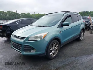 2013 Ford Escape SE with VIN 1FMCU9GX5DUD51120, listed as a IAAI auction lot 42196923 with 183,386 mi miles and . Bid and sale history available at DreamBid. Image 2.