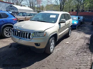 2011 Jeep Grand Cherokee Laredo with VIN 1J4RR4GG8BC590094, listed as a IAAI auction lot 41990149 with 178,510 mi miles. Bid and sale history available at carsss.com. Image 17.