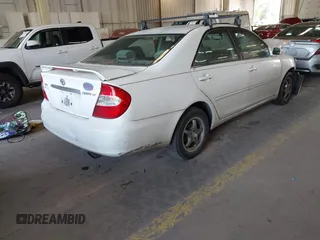 2004 Toyota Camry LE with VIN JTDBE32K540257588, listed as a IAAI auction lot 42208098 with 201,770 mi miles and . Bid and sale history available at DreamBid. Image 4.