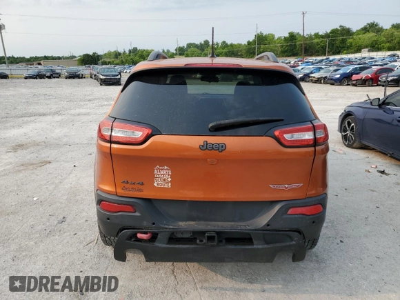 2015 Jeep Cherokee Trailhawk with VIN 1C4PJMBS0FW675807, listed as a Copart auction lot 58800615 with 109,019 mi miles and Salvage title. Bid and sale history available at DreamBid. Image 6.