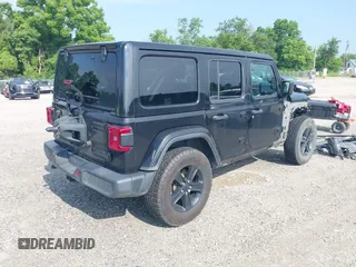 2020 Jeep Wrangler Unlimited Sahara High Altitude with VIN 1C4HJXEGXLW182581, listed as a IAAI auction lot 42612084 with 52,656 mi miles and . Bid and sale history available at DreamBid. Image 4.
