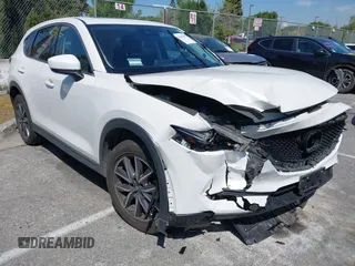2018 Mazda CX-5 Grand Touring with VIN JM3KFADM8J0373368, listed as a IAAI auction lot 42013535 with 63,142 mi miles and . Bid and sale history available at DreamBid. Image 1.