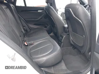 2018 BMW X1 sDrive28i with VIN WBXHU7C38J5L05985, listed as a IAAI auction lot 42014649 with 77,082 mi miles. Bid and sale history available at carsss.com. Image 8.