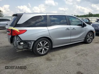 2021 Honda Odyssey Touring z VIN 5FNRL6H85MB039444, wystawiony jako Copart lot #57142205 z przebiegiem 74 228 mil mil oraz Szkoda całkowita • Salvage title. Historia ofert i sprzedaży dostępna na DreamBid. Obrazek 3.