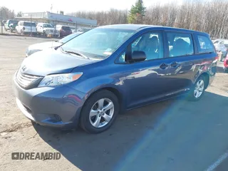2014 Toyota Sienna L with VIN 5TDZK3DC0ES413970, listed as a IAAI auction lot 40870422 with 138,589 mi miles. Bid and sale history available at carsss.com. Image 2.