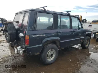 1991 Isuzu Trooper z VIN JACCH58E3M7900325, wystawiony jako Copart lot #79525294 z przebiegiem 146 593 mil mil oraz Czysty tytuł • Clean title. Historia ofert i sprzedaży dostępna na DreamBid. Obrazek 3.