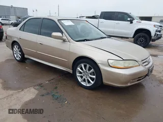 2001 Honda Accord EX z VIN 1HGCG165X1A077702, wystawiony jako IAAI lot #41770556 z przebiegiem 149 516 mil mil oraz . Historia ofert i sprzedaży dostępna na DreamBid. Obrazek 1.