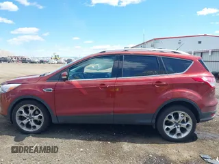 2014 Ford Escape Titanium with VIN 1FMCU9J91EUB53601, listed as a IAAI auction lot 42066465 with 105,933 mi miles and . Bid and sale history available at DreamBid. Image 14.