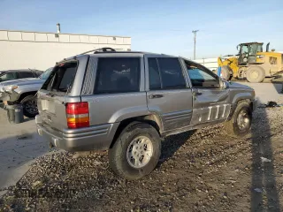 1998 Jeep Grand Cherokee Limited с VIN 1J4GZ78Y0WC260231, выставлен на аукционе Copart как лот 85149724 с пробегом 203 258 миль миль и Списание • Salvage title. История ставок и продаж доступна на DreamBid. Изображение 3.