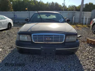 2002 Ford Crown Victoria Police with VIN 2FAFP71W52X157857, listed as a Copart auction lot 65963304 with 203,427 mi miles and Clean Title. Bid and sale history available at carsss.com. Image 5.