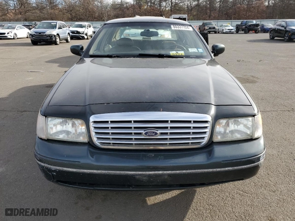 1999 Ford Crown Victoria LX with VIN 2FAFP74W7XX214966, listed as a Copart auction lot 80337724 with 134,624 mi miles and Salvage Title. Bid and sale history available at carsss.com. Image 5.
