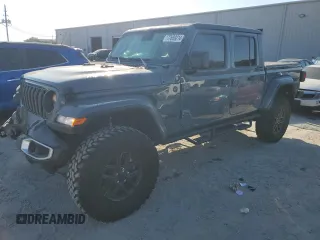 2024 Jeep Gladiator Sport S z VIN 1C6JJTAG7RL115115, wystawiony jako Copart lot #77639214 z przebiegiem 1 302 mil mil oraz Szkoda całkowita • Salvage title. Historia ofert i sprzedaży dostępna na DreamBid. Obrazek 1.