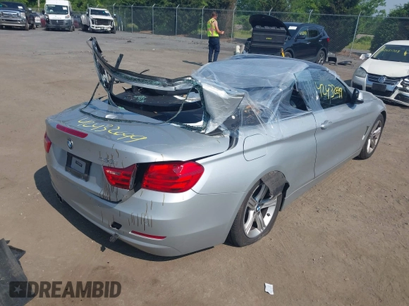 2014 BMW 4 Series 428i with VIN WBA3V7C55EJ873028, listed as a IAAI auction lot 42432699 with 24,063 mi miles and . Bid and sale history available at DreamBid. Image 4.
