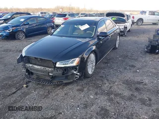 2015 Audi A8 L 4.0T with VIN WAU32AFD4FN014063, listed as a IAAI auction lot 41501970 with 158,570 mi miles. Bid and sale history available at carsss.com. Image 18.