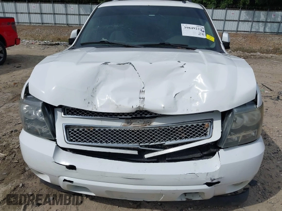 2014 Chevrolet Suburban LT with VIN 1GNSCJE08ER185472, listed as a IAAI auction lot 39849223 with 198,853 mi miles. Bid and sale history available at carsss.com. Image 6.