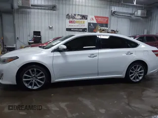 2014 Toyota Avalon Limited with VIN 4T1BK1EB6EU100635, listed as a IAAI auction lot 41609581 with 128,609 mi miles. Bid and sale history available at carsss.com. Image 14.